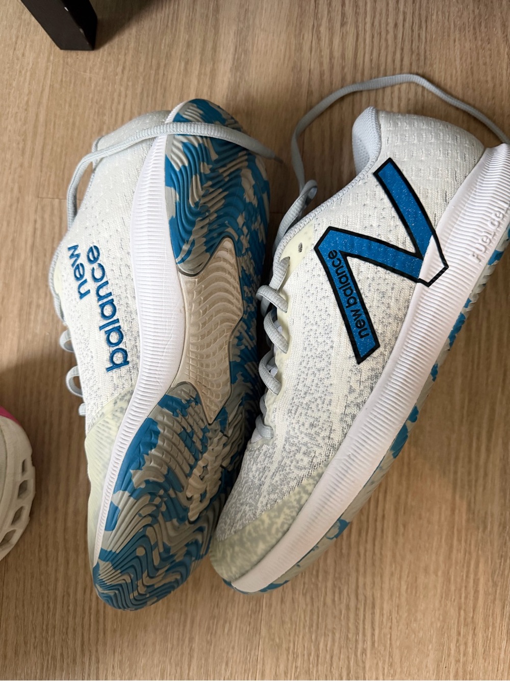 New Balance woman’s pickleball White & Blue Athletic Sneakers